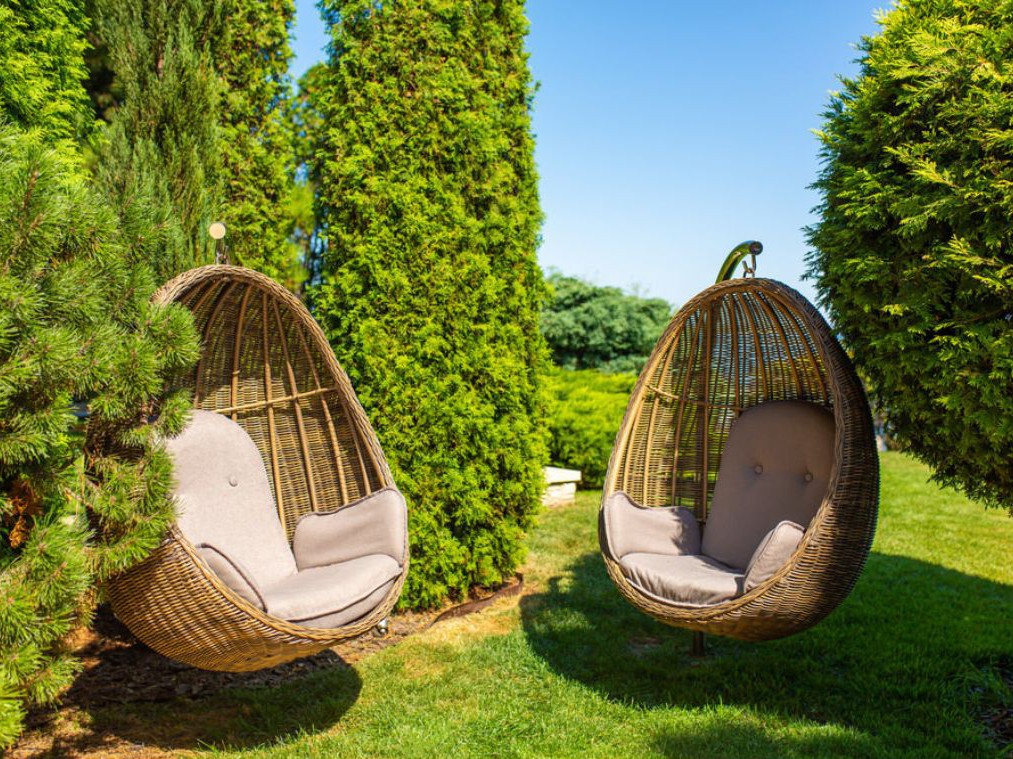 With a hanging egg chair, you can remain out of sight despite not having any trees or shrubs in your backyard is one of the 8 Privacy Solutions.